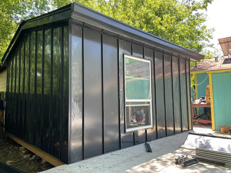 Black standing seam metal wall panels for Roof Inspection in McCordsville